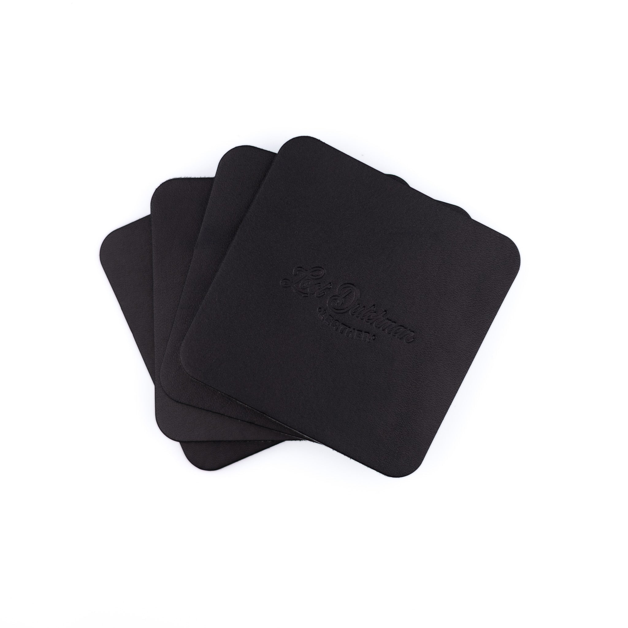 Four black coasters with a logo on a white background