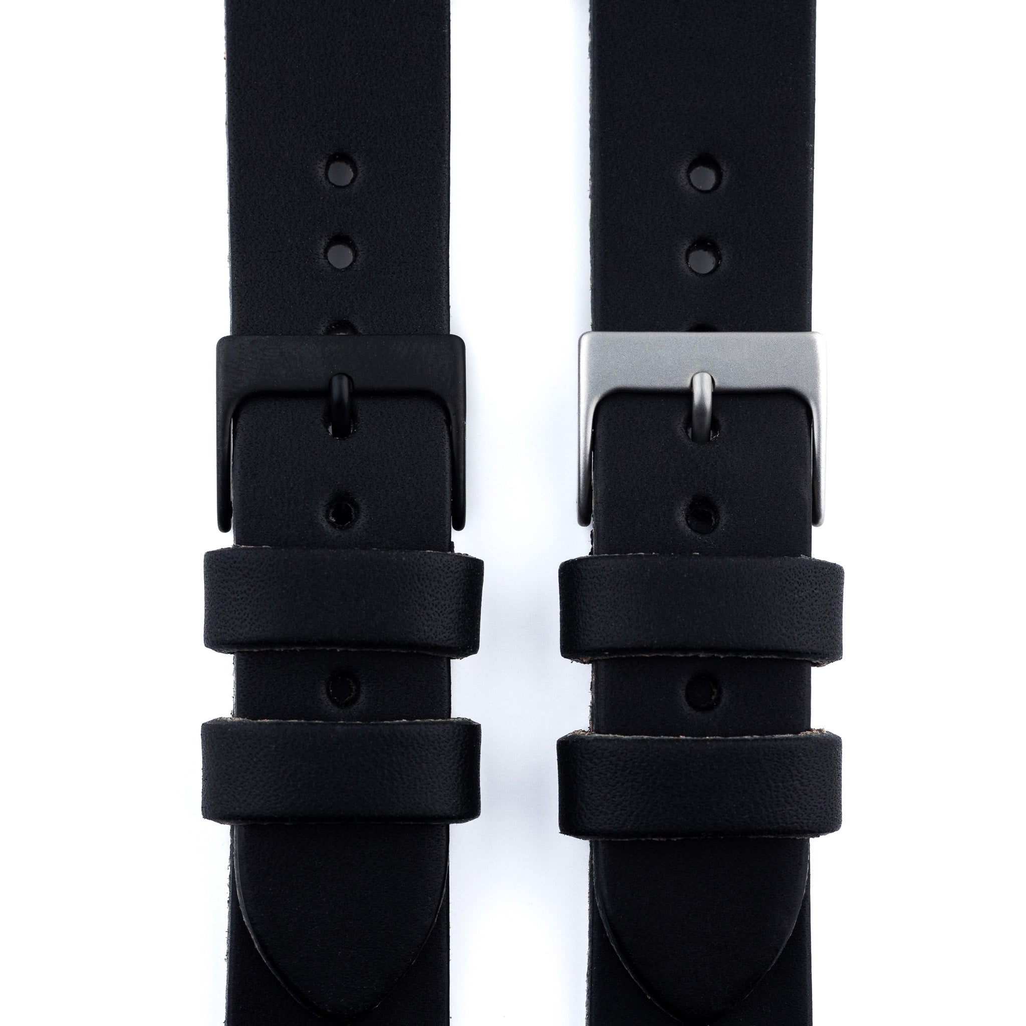 Two black watch straps with buckles on a white background