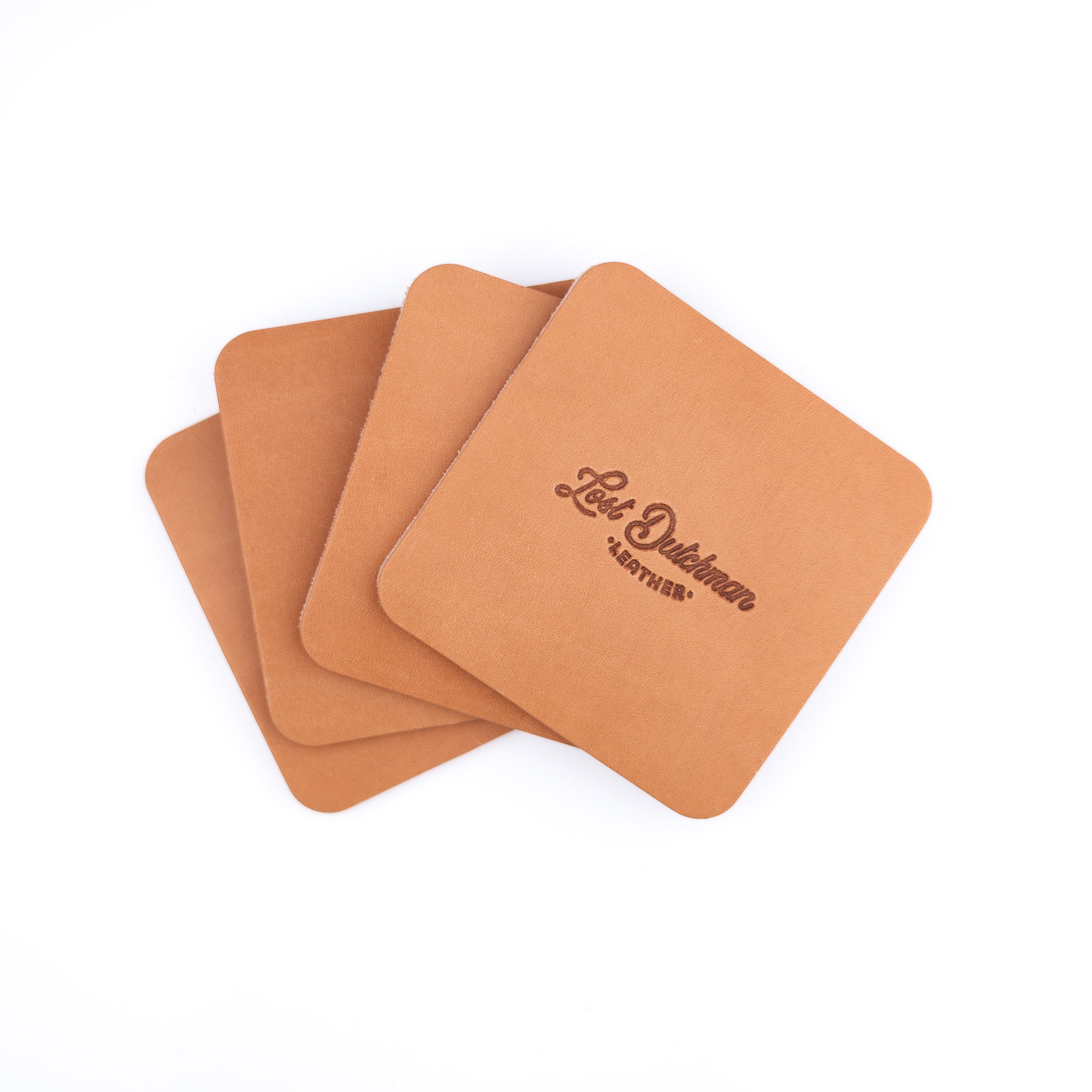 Set of four russet leather coasters with a Lost Dutchman Leather logo on a white background